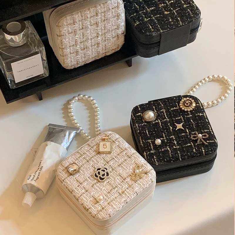 Tweed storage pouches with pearl handles